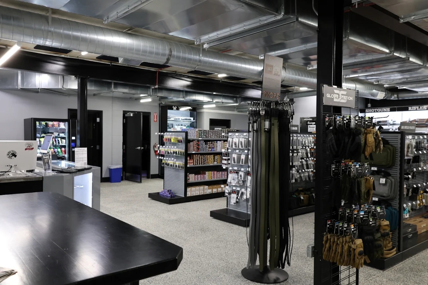 Firearms, ammunition, and range gear inside The Range retail store